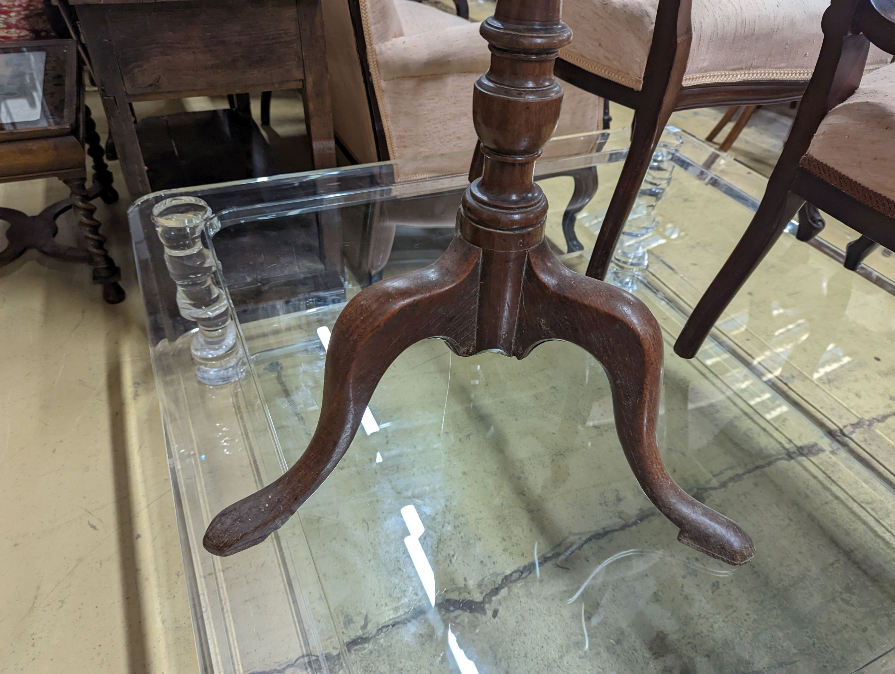 A 19th century oak stool and an oak tripod table, table diameter 53cm, 70cm height